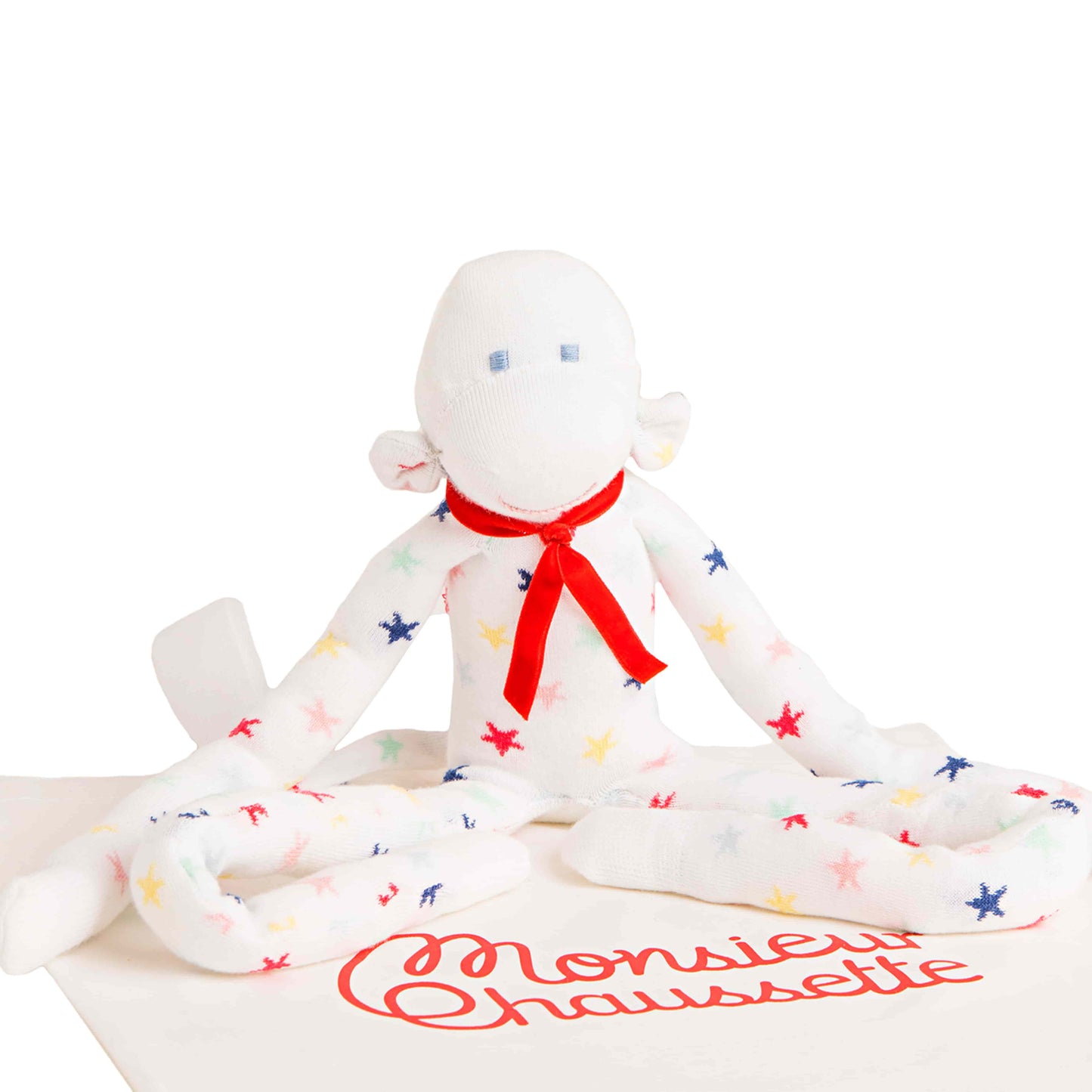 doudou singe marcel à étoiles assis sur un tote bag monsieur chaussette
